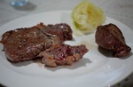 rib-eye (left) and sirloin beef steaks (medium rare) with boiled cabbage